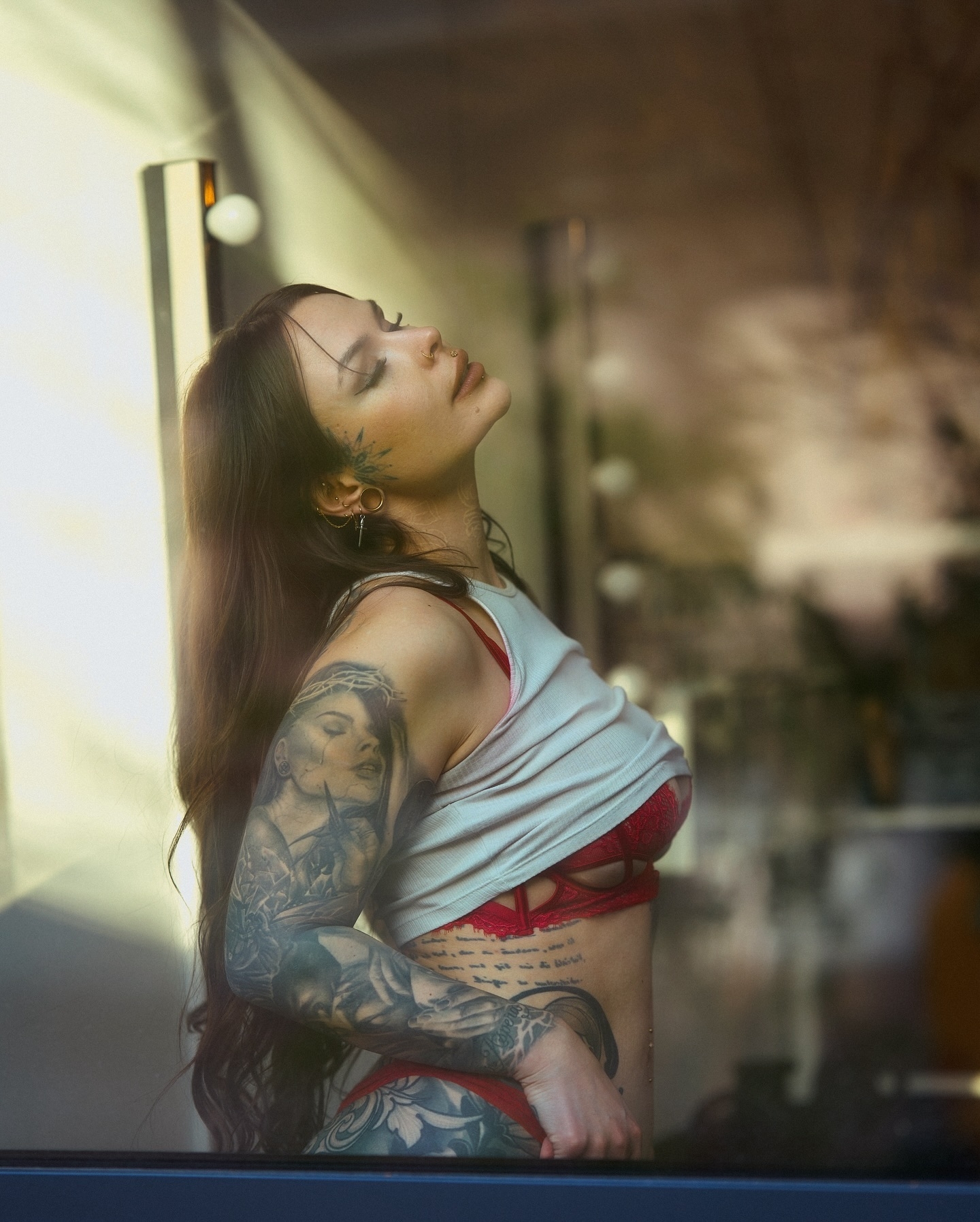 Confidence in Reflection: Intimate Self-Portrait with Tattoos and Bold Fashion
