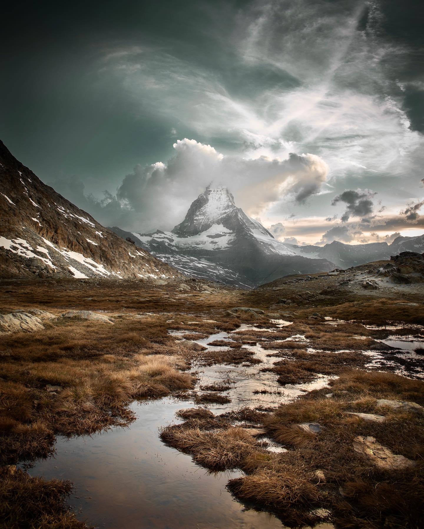 Majestic Mountain Peak Amidst Stormy Skies