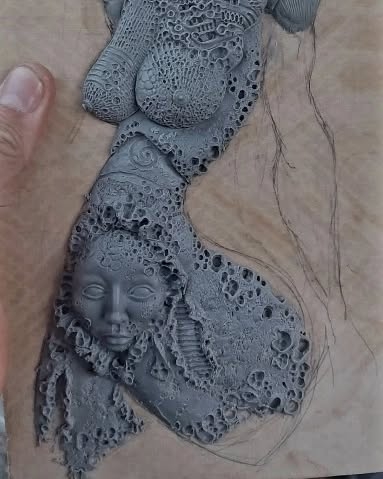 Unfinished Elegance: Stone Carving of a Woman's Form