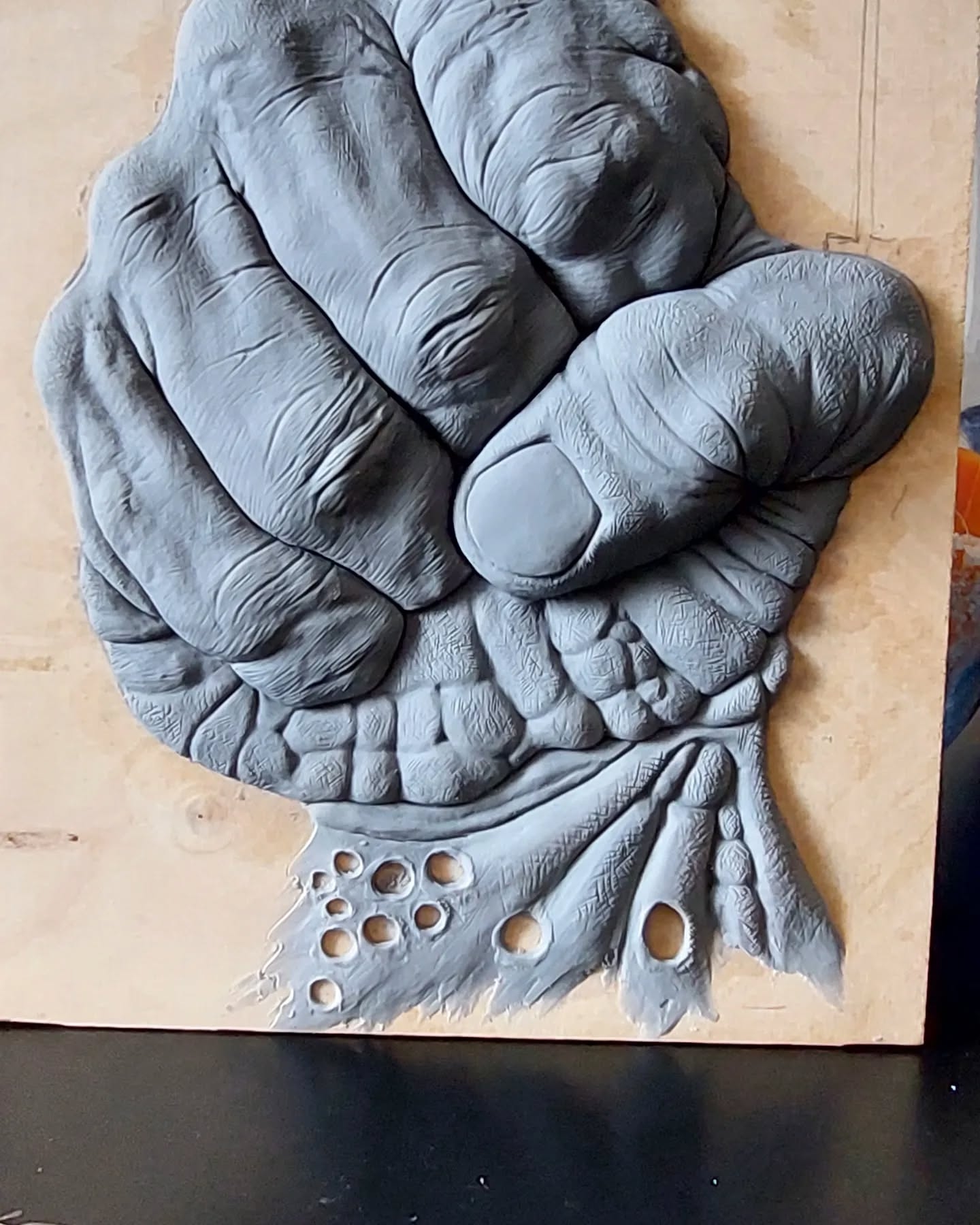 Grasping the Current: Hand and Fish Tail in Clay