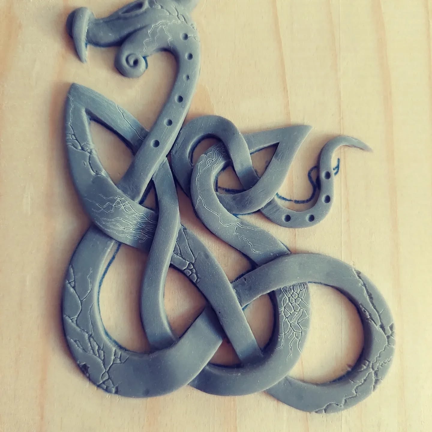 Eternal Coiling: Stylized Clay Serpent