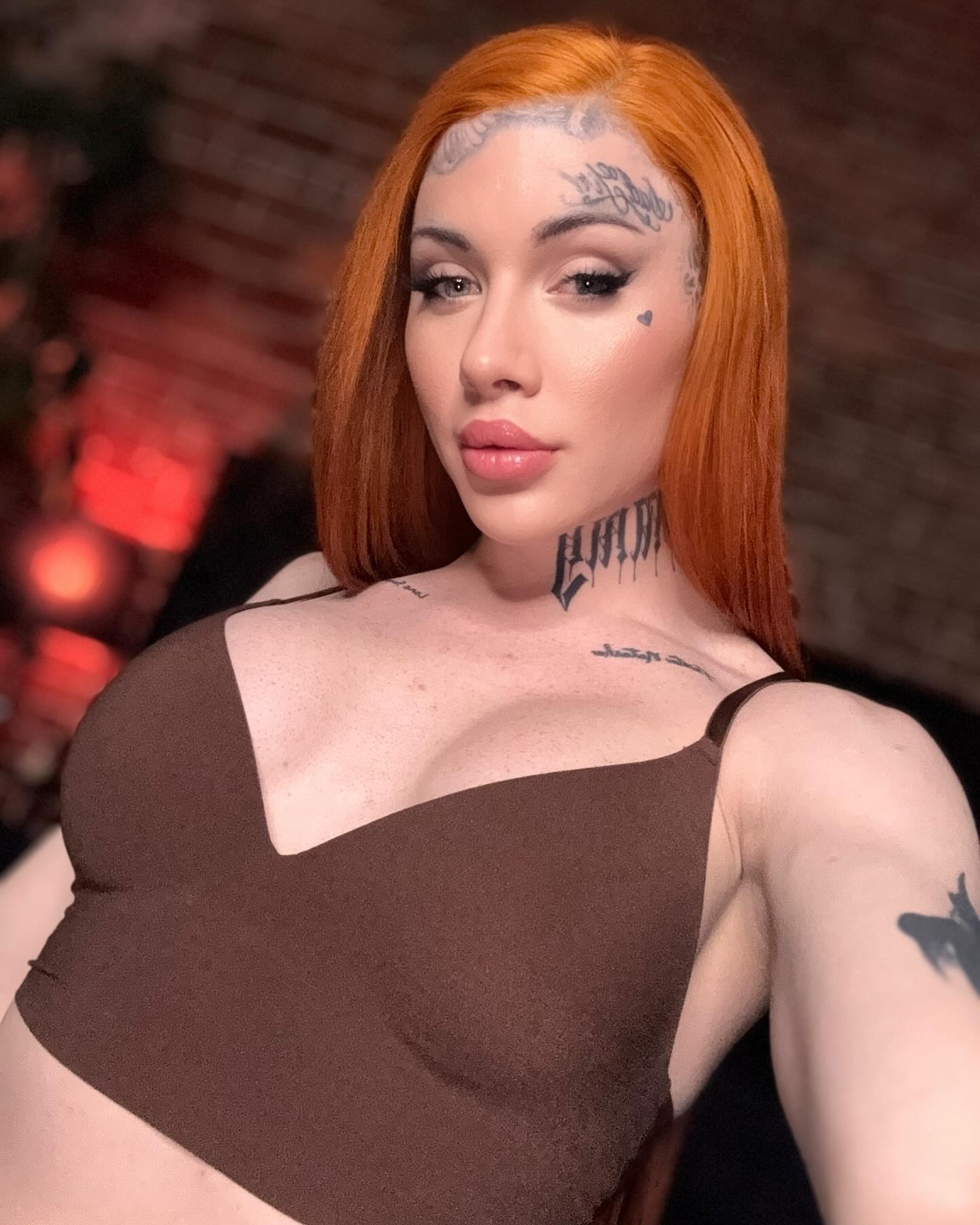 Emboldened Tattoos & Confident Style: Redhead's Artistic Lifestyle Portrait