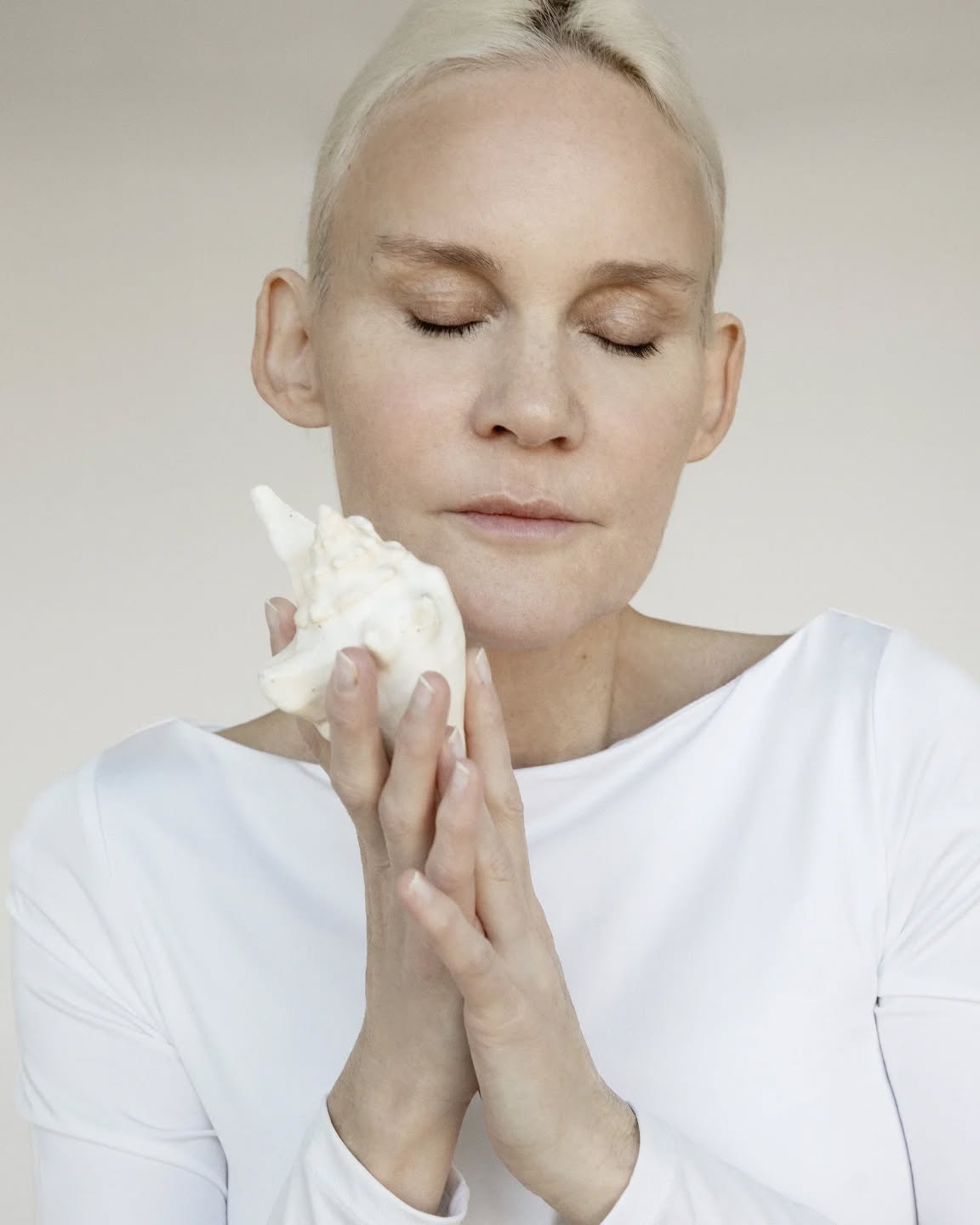 Whispers of the Sea: Serene Moment with a Conch Shell