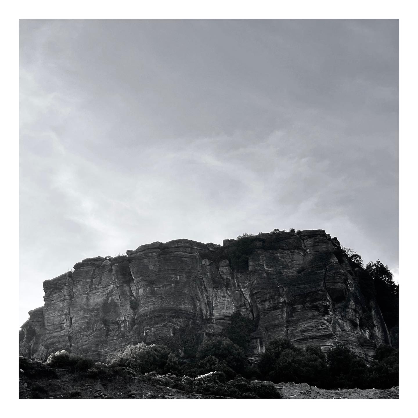 Eternal Vigil: Time-Weathered Cliffs in Monochrome