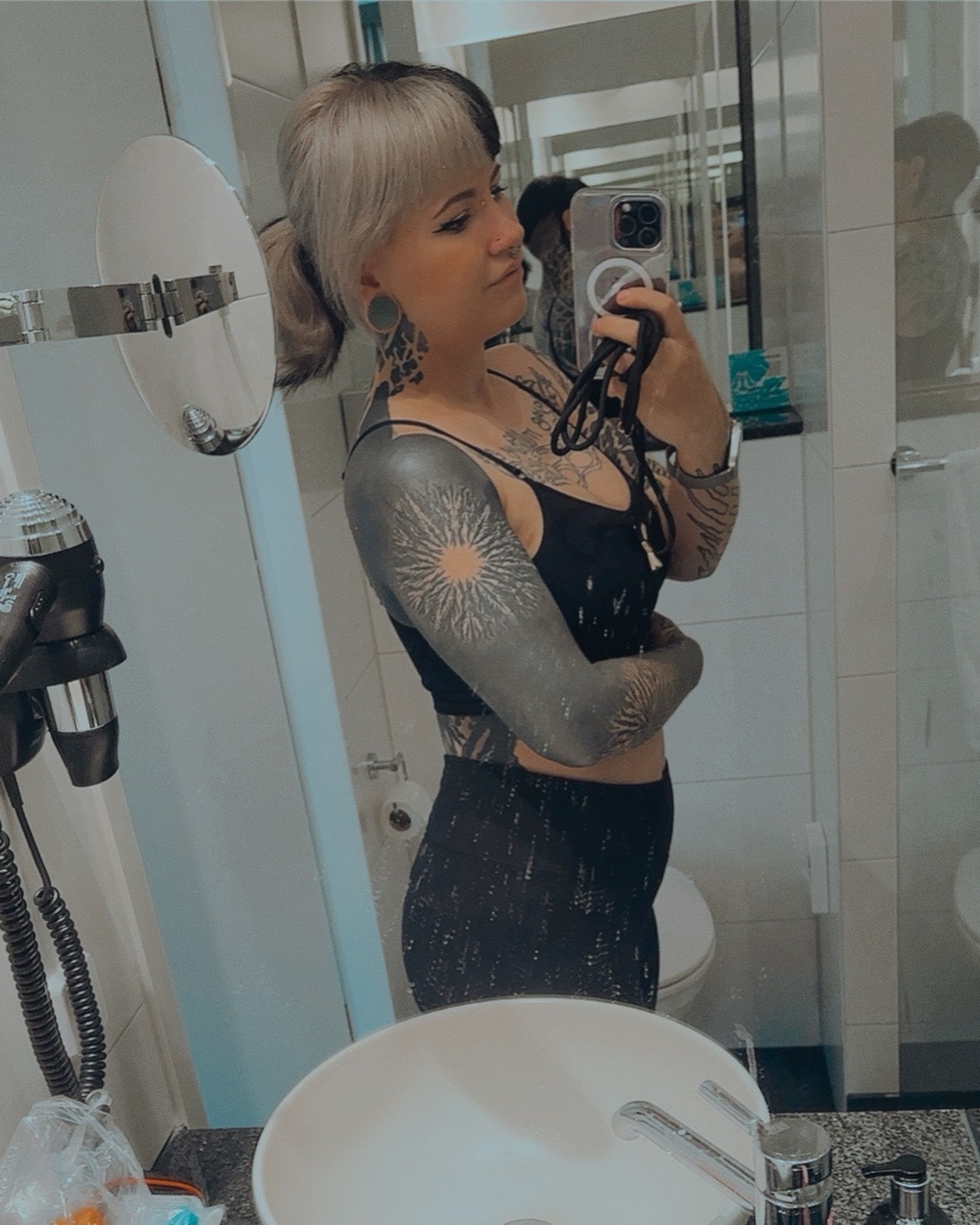 Self-Expression in the Frame: Mirror Selfie with Bold Tattoos