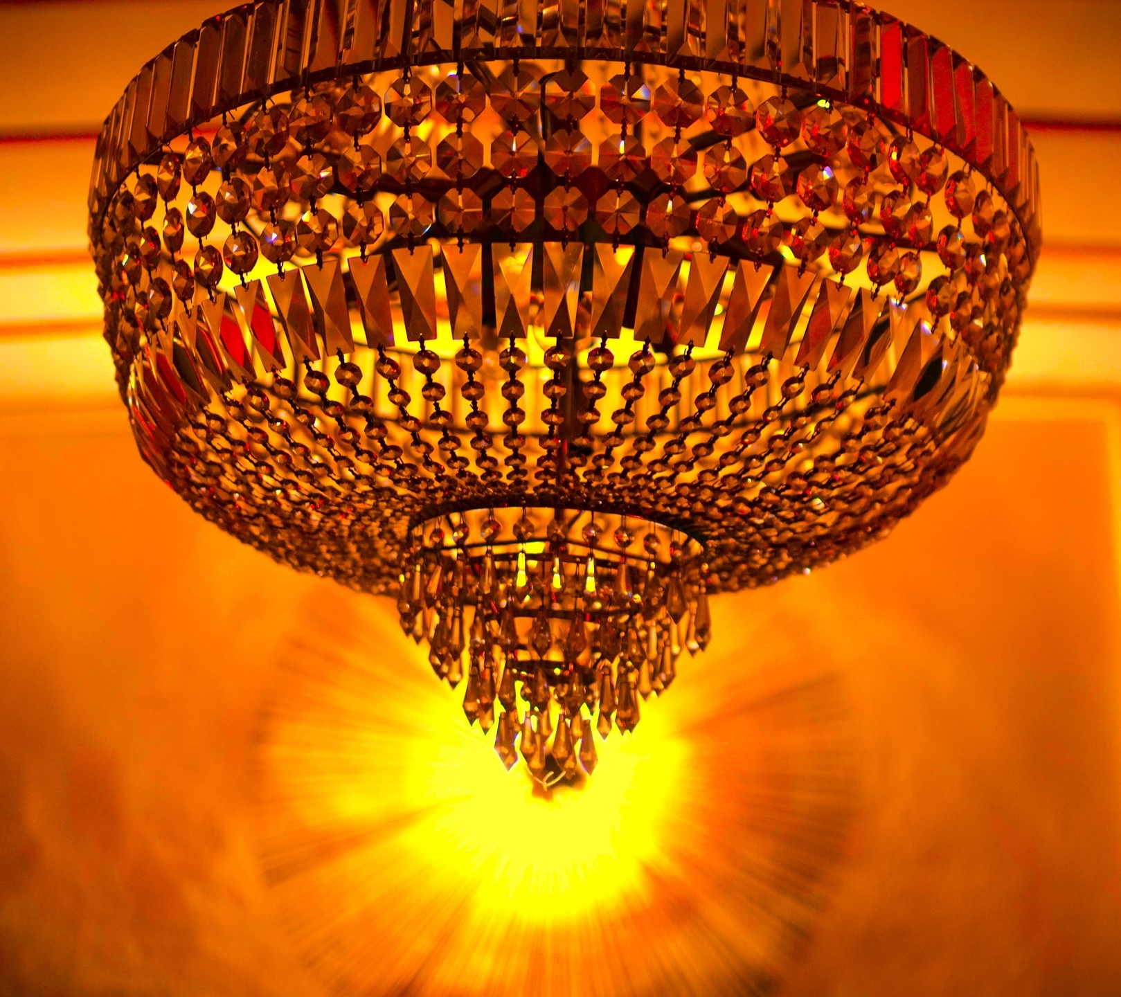Glowing Crystal Chandelier: Elegance in Golden Light